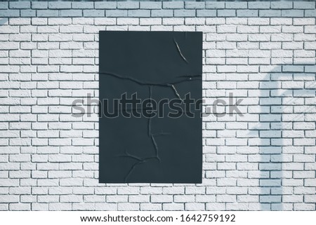 Blank black banner on loft style brick wall. Presentation concept. Close up