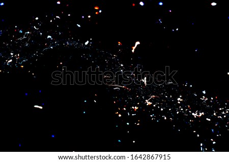 Abstract black background with bright splashes.