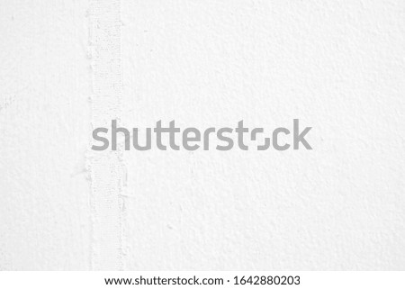 Weathered Adhesive Tape on White Concrete Wall Background.