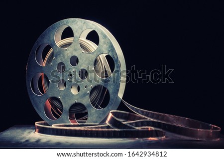 Movie reel on a wooden background