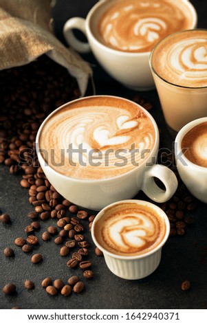 Cups of espresso and a bag of coffee beans served 