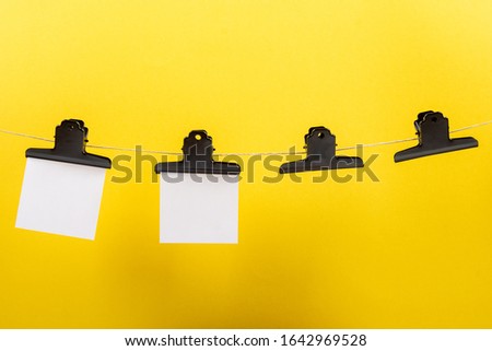 blank notes hanging on a clothesline