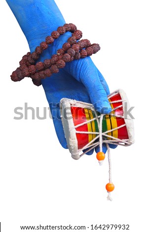 Pellet Drum (Damroo) Musical instrument in hand (shiva hand) Maha shivratri Royalty-Free Stock Photo #1642979932