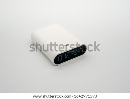 the PM2.5 detector isolated on white background. The detector is useful to check the AQI which means air quality index