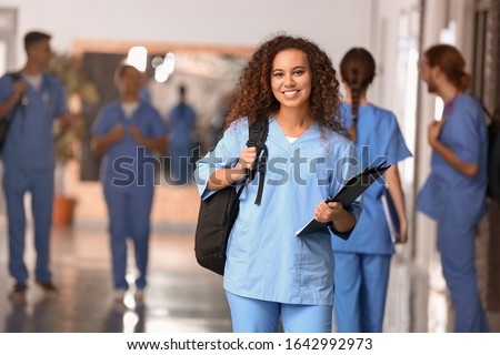 African-American student in corridor of medical university Royalty-Free Stock Photo #1642992973