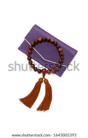 Buddhist rosary. Wooden buddhist rosary with red tassel.