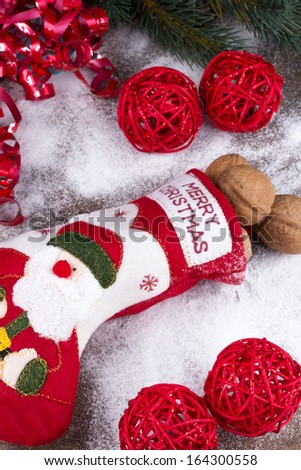 Christmas stocking with nuts, powdered sugar and decorations