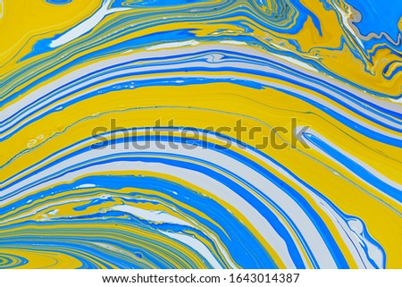 Abstract multicolored liquid solution surface macro close up from above