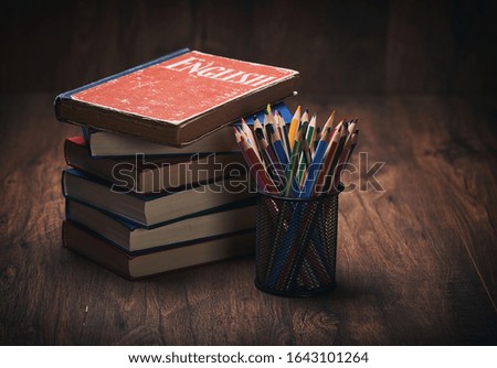 learning english concept. book on a wooden table background