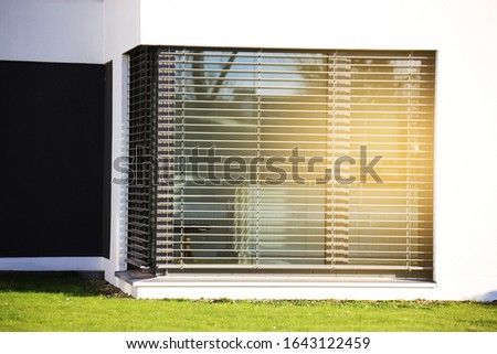 Window with modern blind, exterior shot Royalty-Free Stock Photo #1643122459