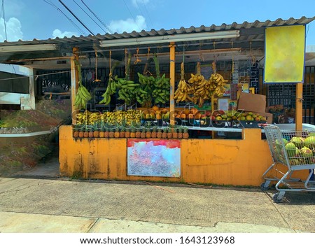Vintage Roadside Fruit and Veggie Stand in an Economically Challenged Zone; Hard Work, Make Ends Meet, Inflation and the Economy Royalty-Free Stock Photo #1643123968