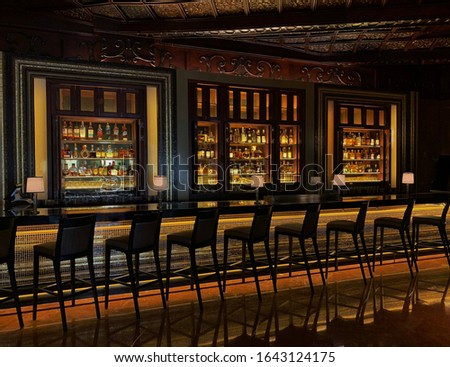 Colorful, Sleek Jazz Bar With Rows of Bar Stools; Empty Bar, Social Distancing Royalty-Free Stock Photo #1643124175