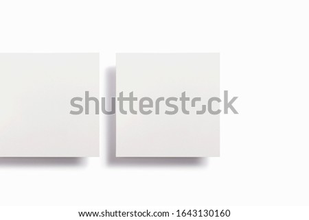 2 square blank frames with different shadows soaring in the air and isolated on white for easy editing, stories or photos template for graphic designers presentations, portfolios etc.