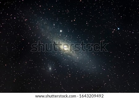 A view of Andromeda spiral Galaxy (M31) and its companions M32 and M110 Galaxies. Billions of stars live on this three galaxies and inside it bright galactic core a black hole resides