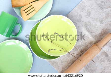 rustic table with green utensils