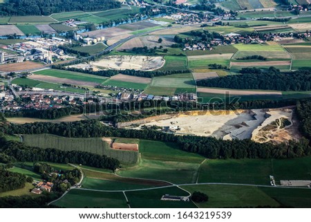 aerial rural village grass trees Royalty-Free Stock Photo #1643219539