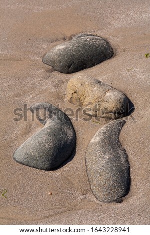 Abstract natural arrangement of rocks on Carnlough beach, County Antrim.