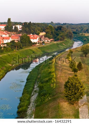 Small river in the town Vukovar, Croatia. Early morning.