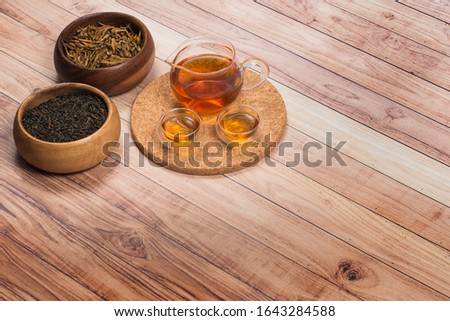Chinese red tea with tea set on cork stand. Top view