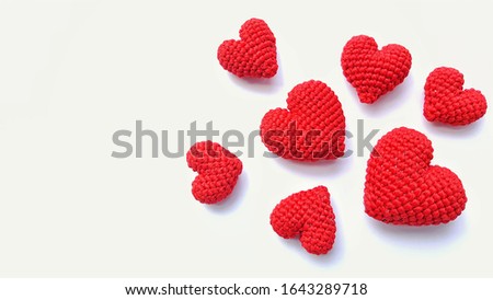 Red hearts Hand made amigurumi crochet knitting Isolated on white background.