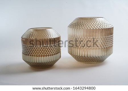 Round-shaped glass ornaments for storing small items as well as for display in hotels, offices and homes. Royalty-Free Stock Photo #1643294800