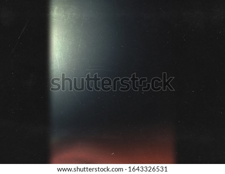 Imitation of the effect of an old photo. Blurred background. Black abstract background. 00s mask. redacted. Foto film. Lens flare and heavy grain. 70s Royalty-Free Stock Photo #1643326531