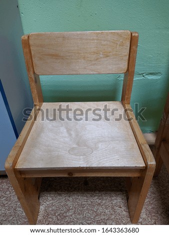 old and small children's wooden chair with back