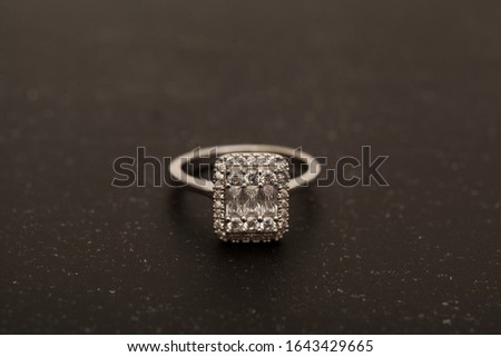 photo of female ring on black color background
