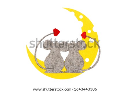 two mice in love with hearts are sitting on moon made of yellow cheese with holes. Symbol of love and valentines day