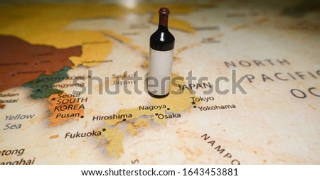 Red wine bottle on a map Japan. Royalty-Free Stock Photo #1643453881