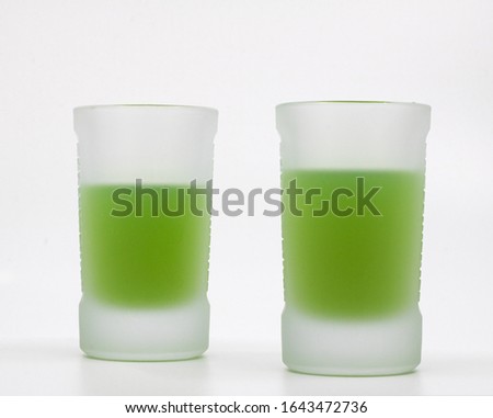 Shot drinks isolated on white background.  Refreshing beverages at frosted glass. Delicious alcoholic drink. Glass of Liquor. Royalty-Free Stock Photo #1643472736