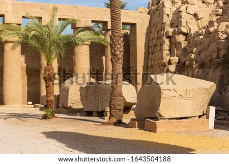 Karnak Temple, Colossal sculptures of ancient Egypt in the Nile Valley in Luxor, Embossed hieroglyphs on the wall