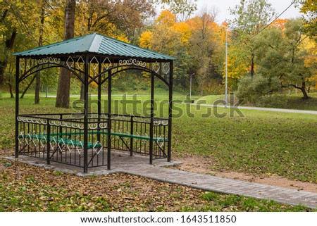 metal gazebo in the autumn park