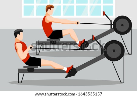 Training athletes on a rowing machine in the gym Royalty-Free Stock Photo #1643535157