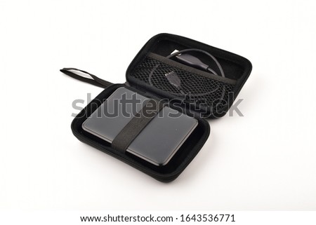 external hard disk and cable in hard disk case isolated on white background