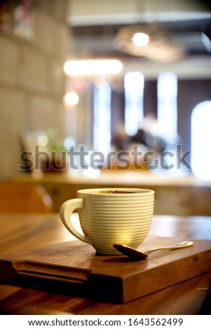 mug of coffee in cafe interior. picture with soft focus and blurred background. with copy space