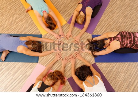 Hands of the women forming circle at Yoga class Royalty-Free Stock Photo #164361860