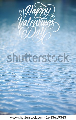 Happy valentine day white latter with water as a background and space