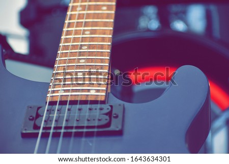 Music background. Tool Vintage photos. Electric guitar. Melody. To sing a song. to play the guitar. Live music. Guitar motif. String musical instrument. Blurred focus. Fuzzy photo
