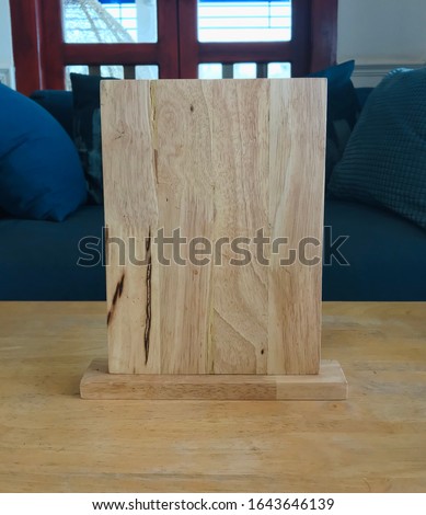 Square wooden plank laid on a large floor