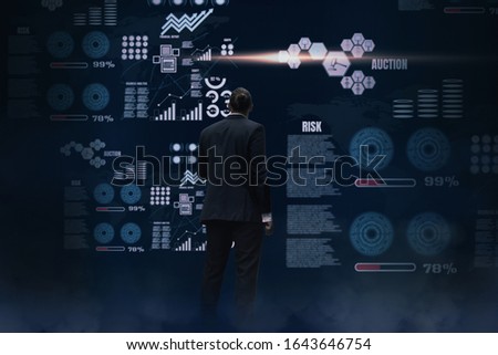 Back rear view Business man standing to analyze business and performance,investment statistics,digital working background virtual panel,chart and financial stock graph,concept business innovation