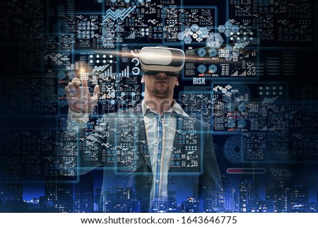 Double exposure-business man wearing VR glasses using finger touch holographic to analyze business,concept investment statistic,digital working background virtual panel,chart and financial stock graph