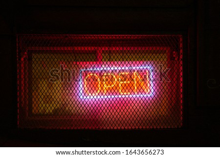 Neon Open Sign in front of Restaurant/Store