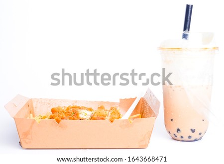A picture of spaghetti carbonara with fried chicken and fresh milk boba tea.