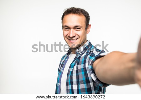 Young man take selfie isolated on white background