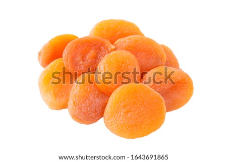 Dry ripe apricots isolated on white background, angle view