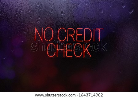 No Credit Check Sign in Rainy Window