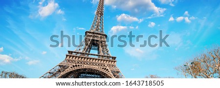 Paris, France. Wonderful view of Tour Eiffel with gardens and colourful sky.
