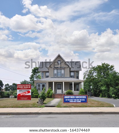 Sold Real Estate Sign Another Success Let Us Help You Buy Sell Your Next Home Front Yard Victorian Suburban Home Blue Sky Clouds USA Residential Neighborhood