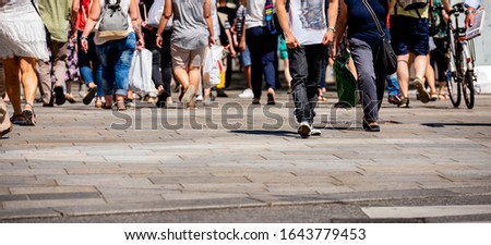 People crossing the street on the crosswalk